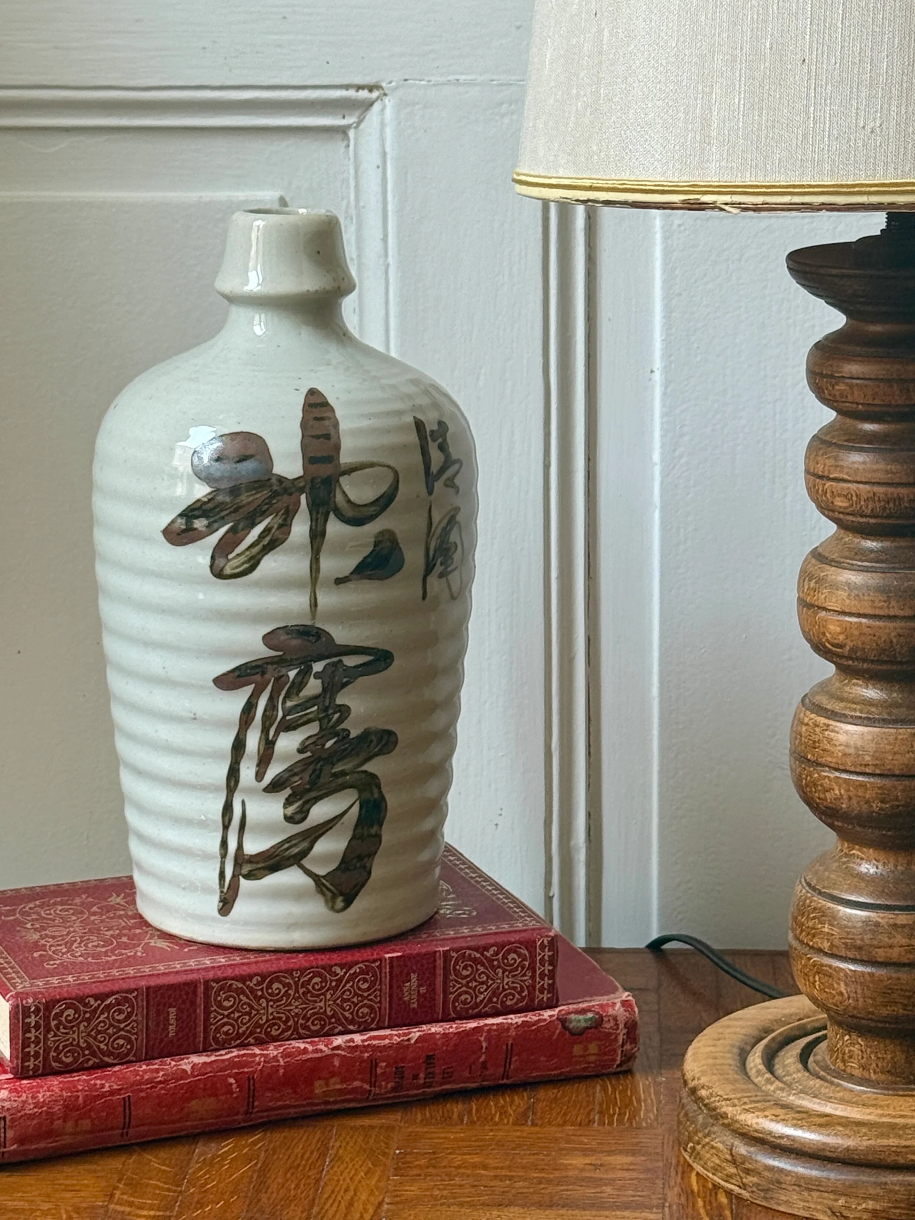 Old Japanese sake bottle in tokkuri shape.
