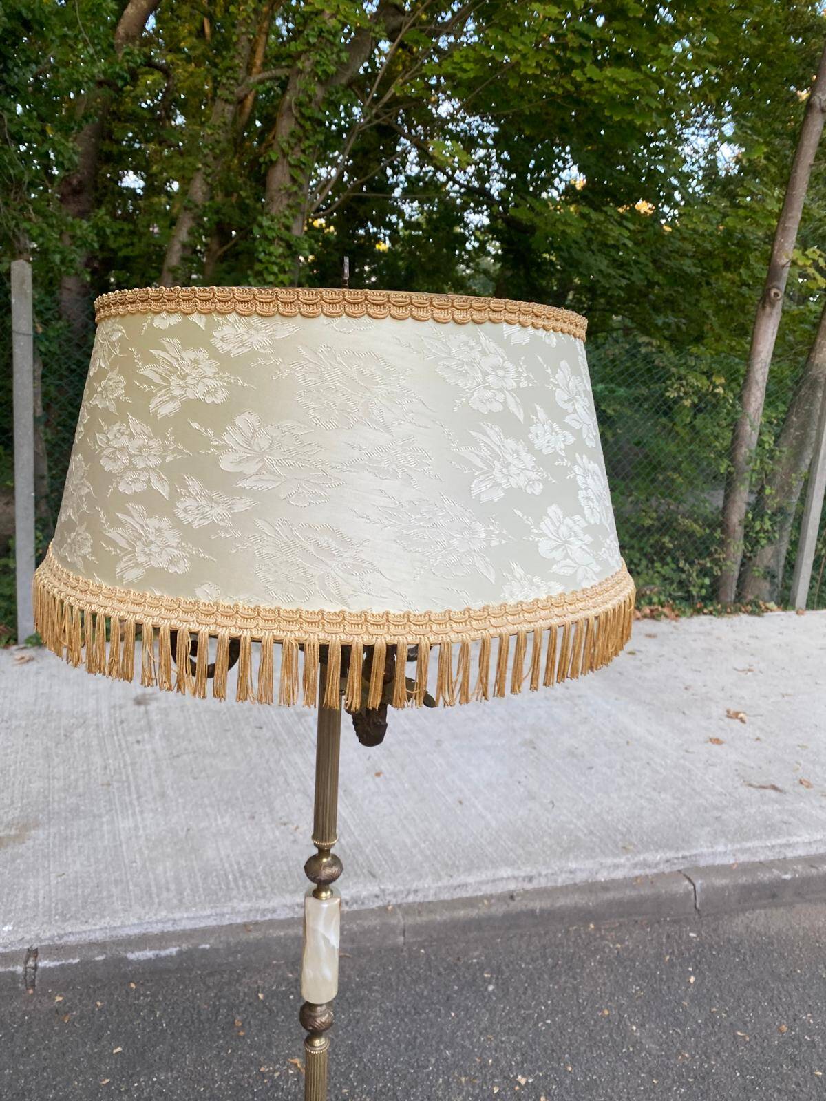 Vintage brass onyx floor lamp with fringed shade.