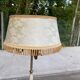 Vintage brass onyx floor lamp with fringed shade.