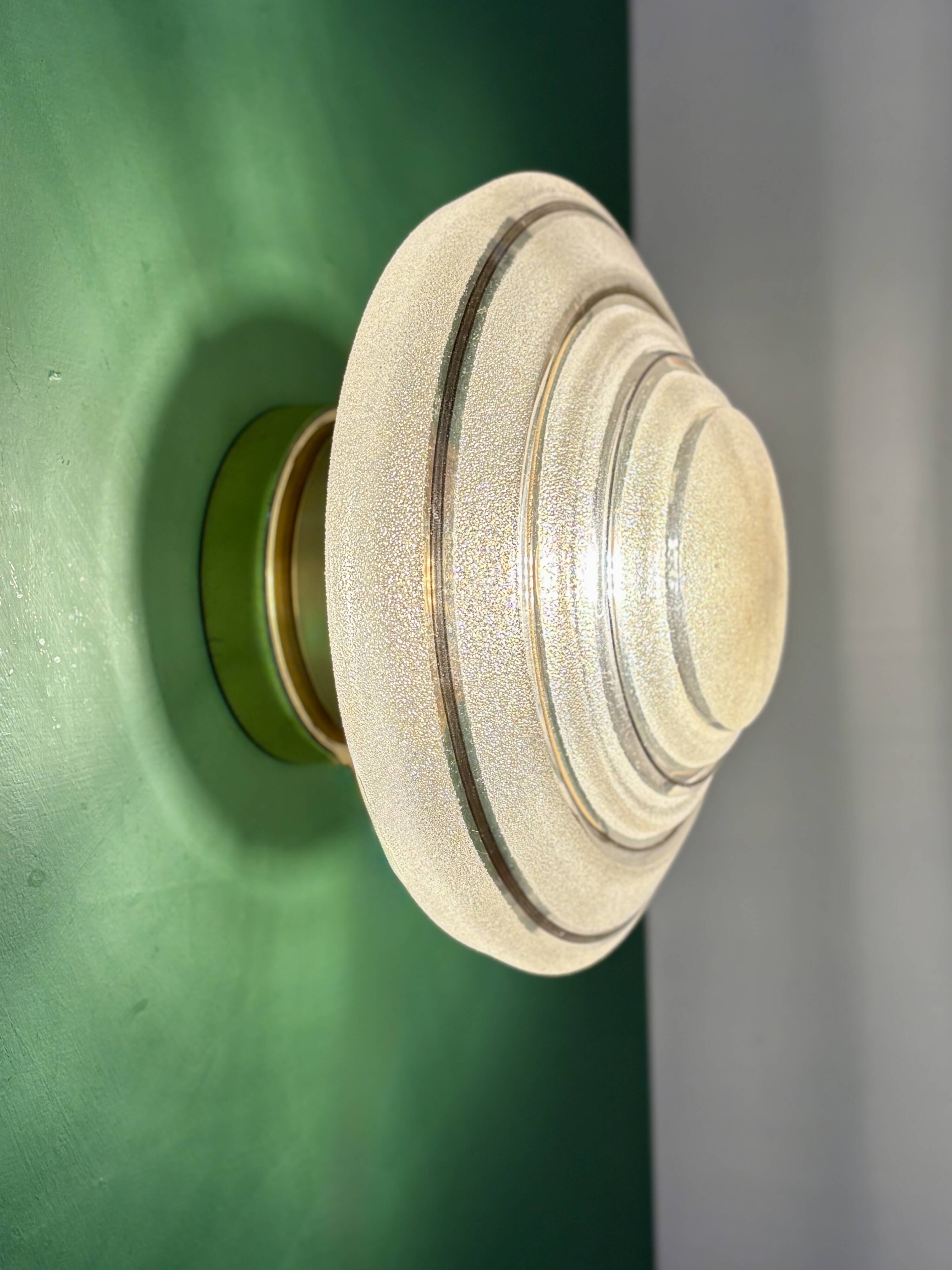 Old glass globe wall/ceiling light in frosted white and gold.