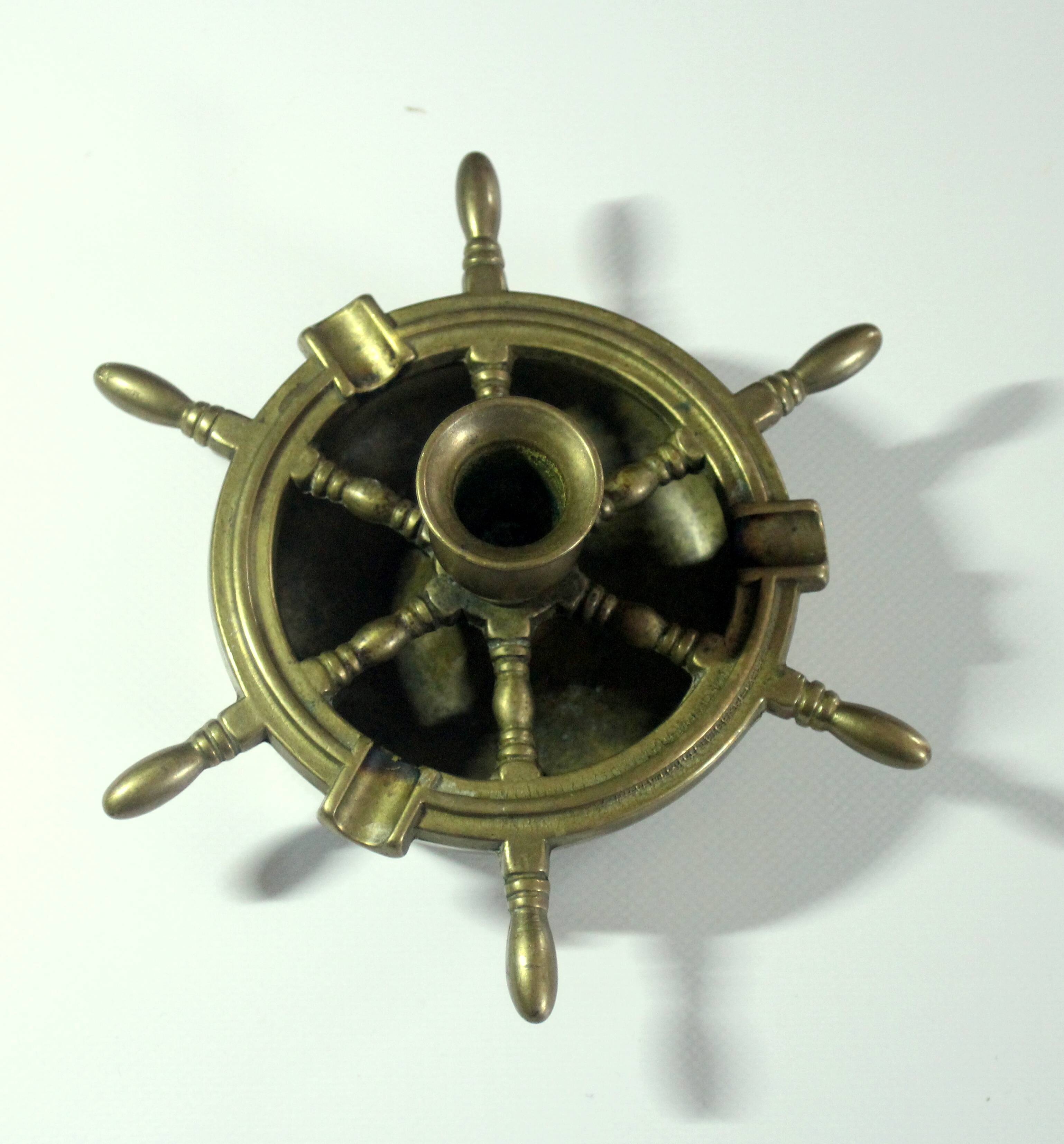 1960s solid brass ashtray in the shape of a steering wheel with a candle stick, vintage