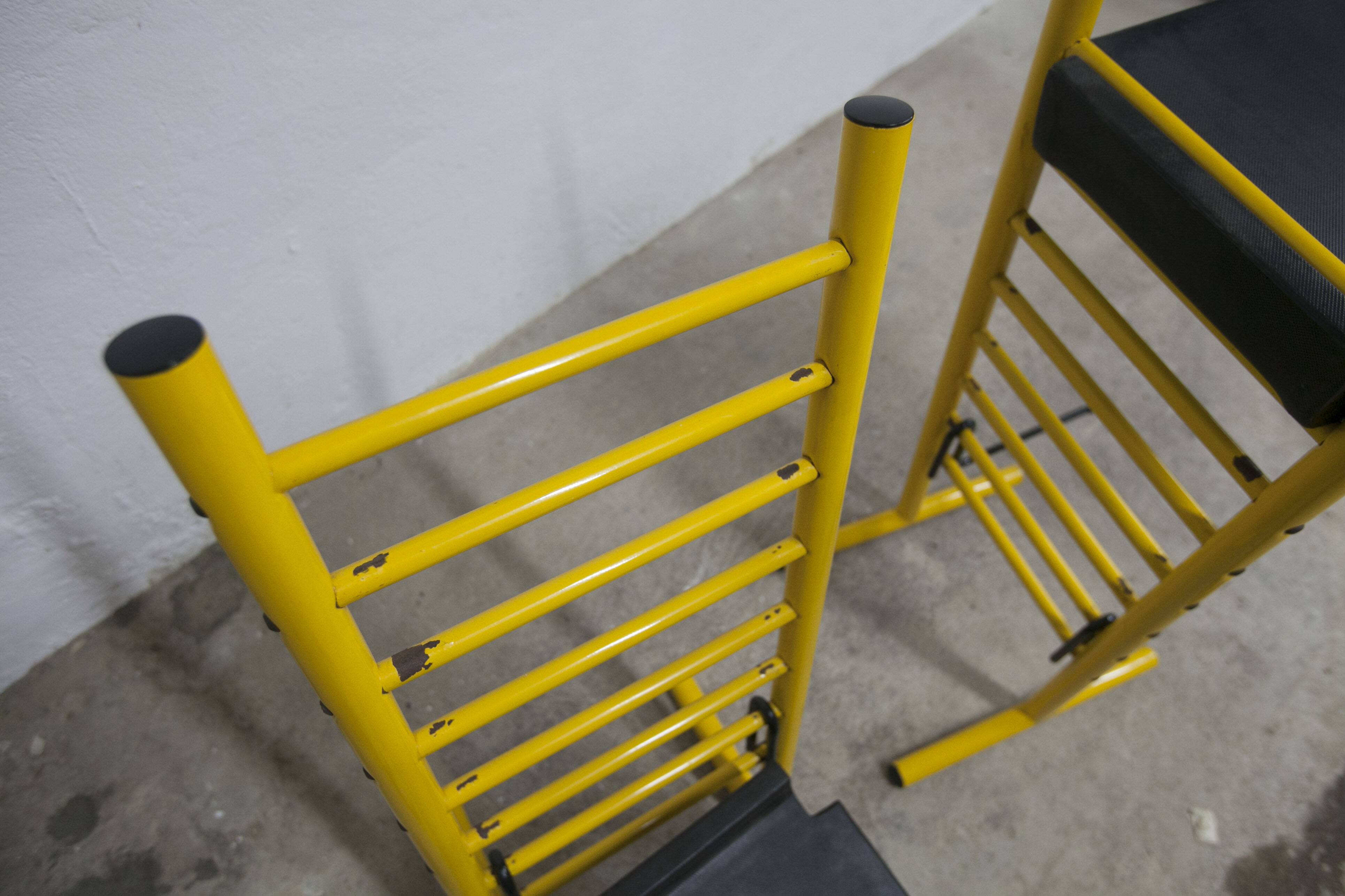 Pair of adjustable Italian bar stools in lacquered yellow and black