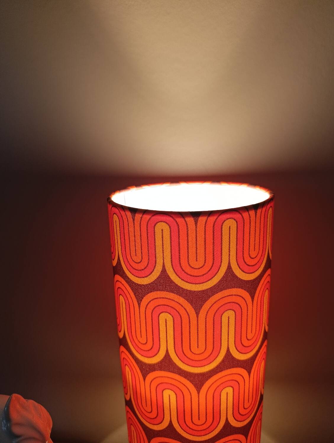Two lamps with a seventies psychedelic wave print.