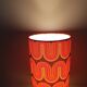 Two lamps with a seventies psychedelic wave print.
