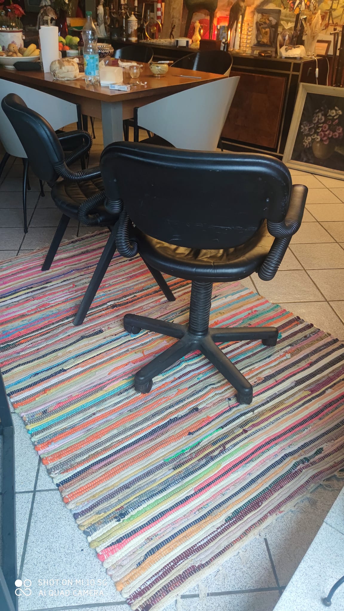Two black leather armchairs