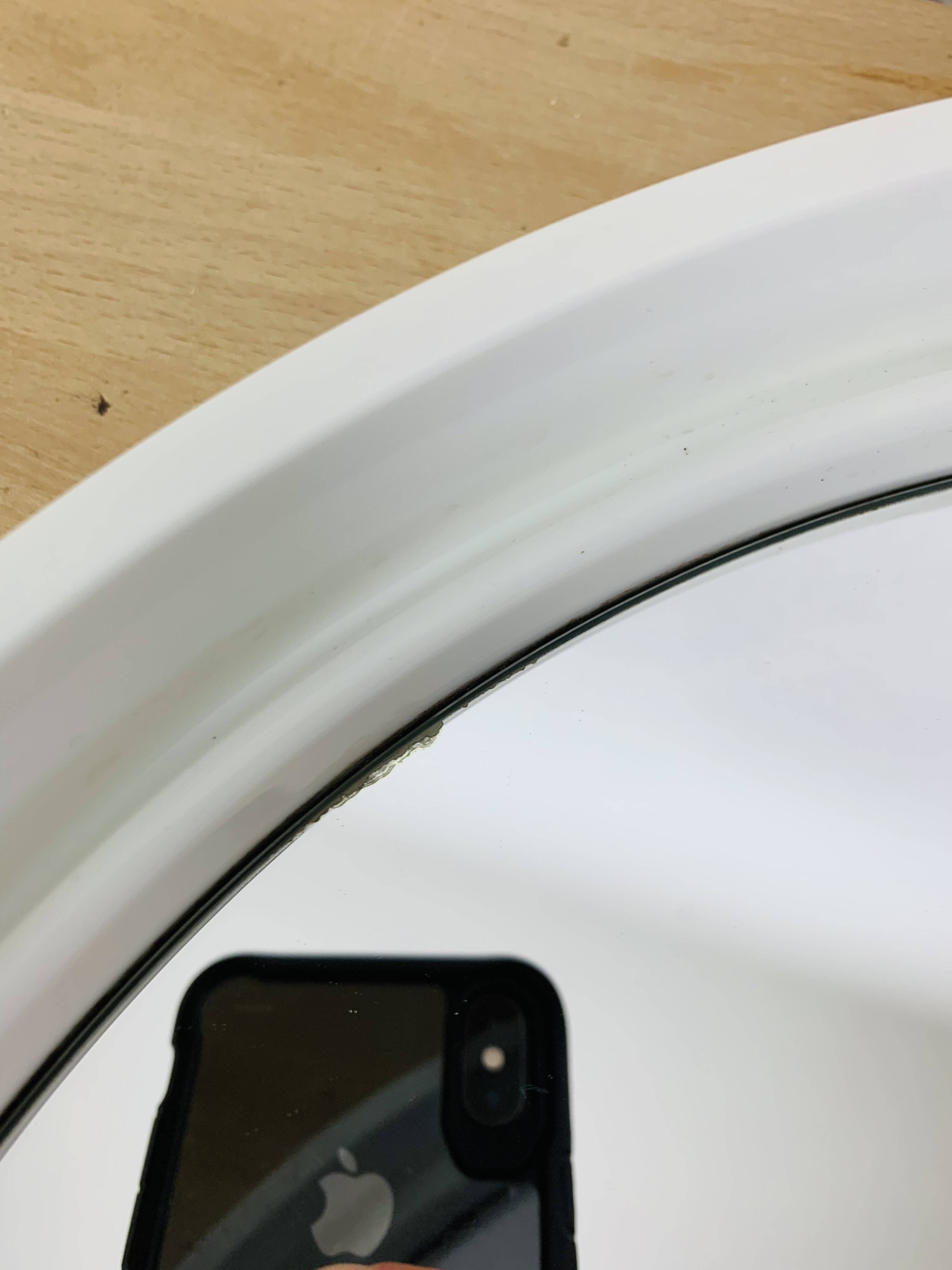 Space age mirror with white frame from the 1970s.