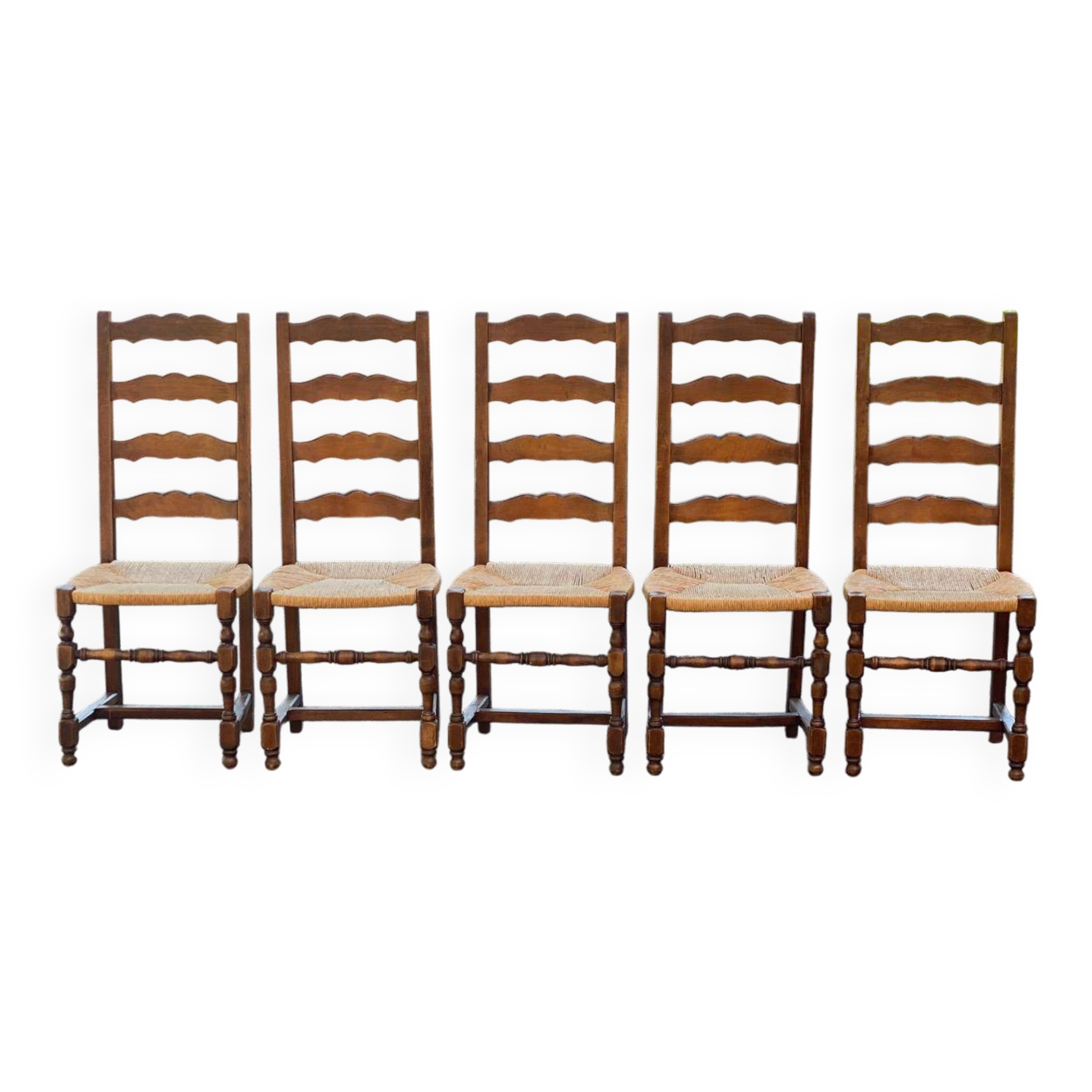 4 or 5 solid wood chairs with light oak straw and high backs
