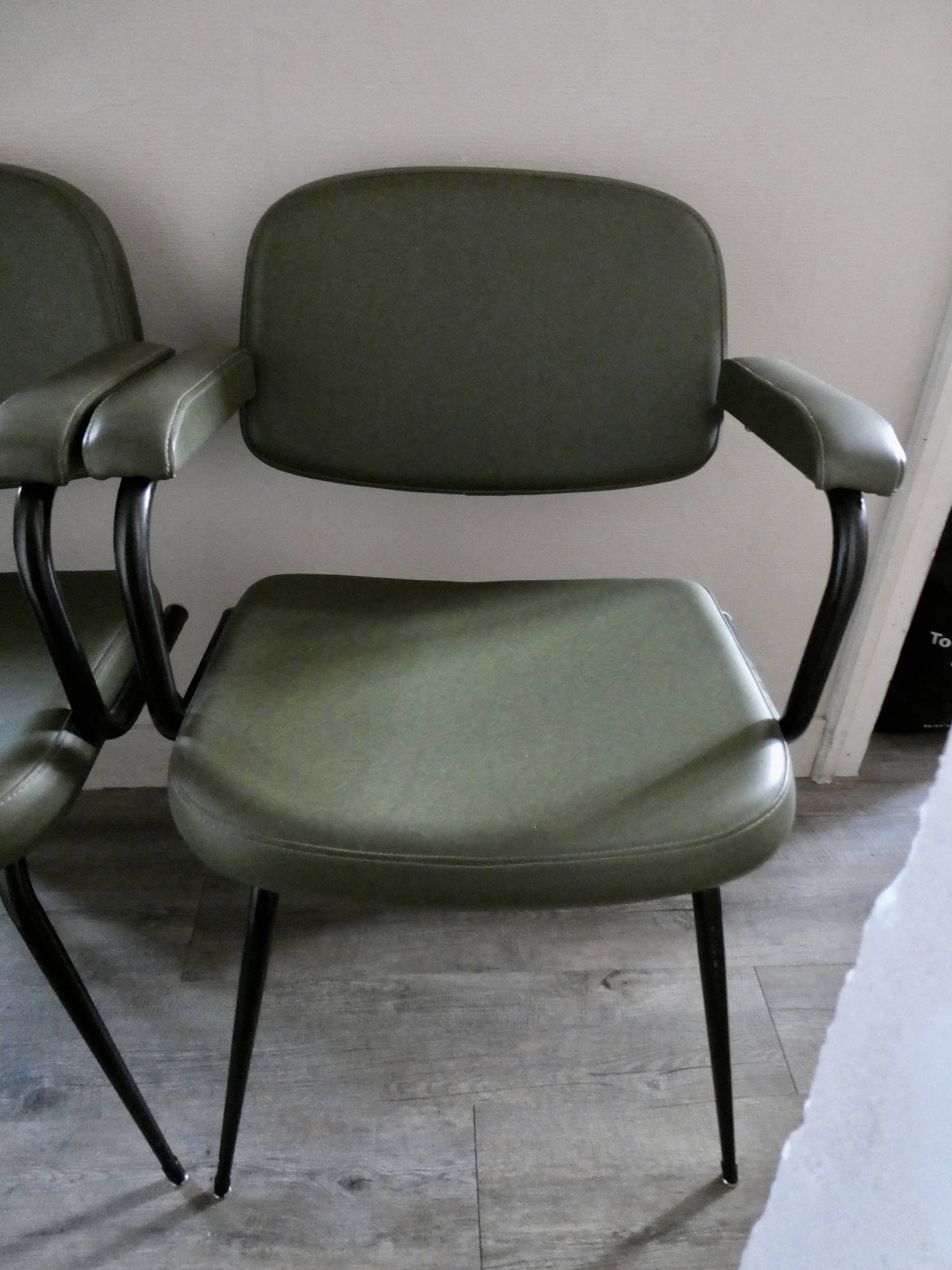 Pair of khaki green metal and skai armchairs from the 1960s