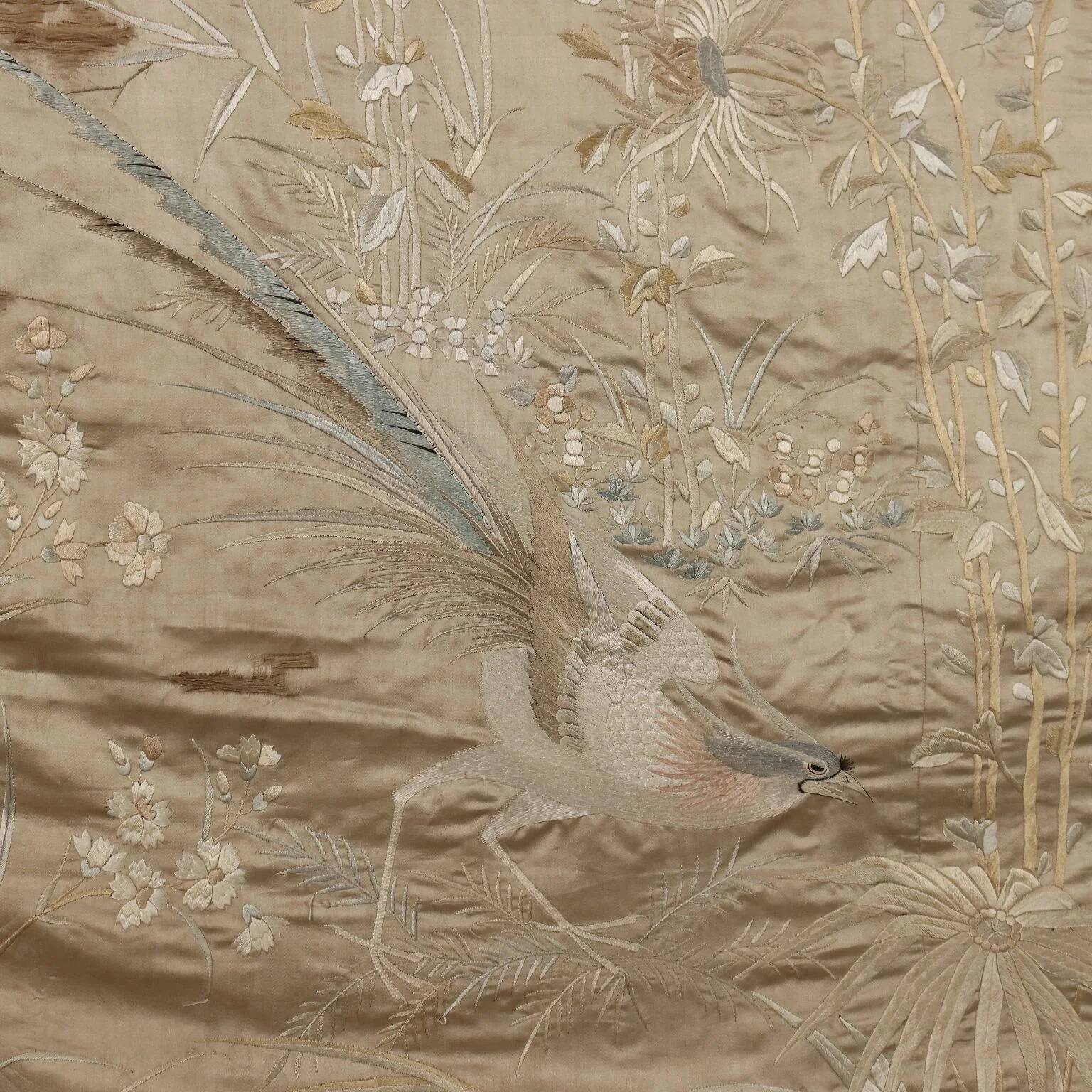 Large antique screen in coloured and embroidered silk, 19th century.