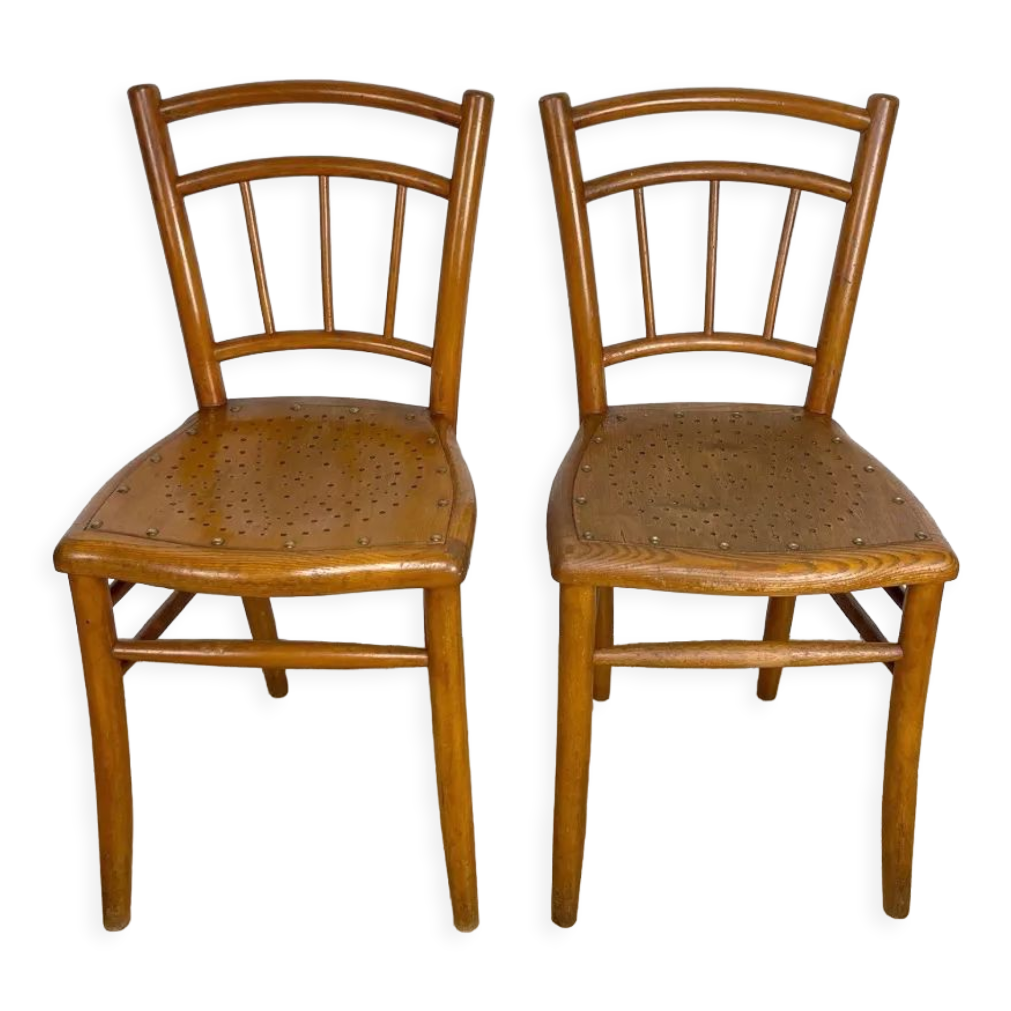 Pair of curved wood bistro chairs and studded and perforated seat