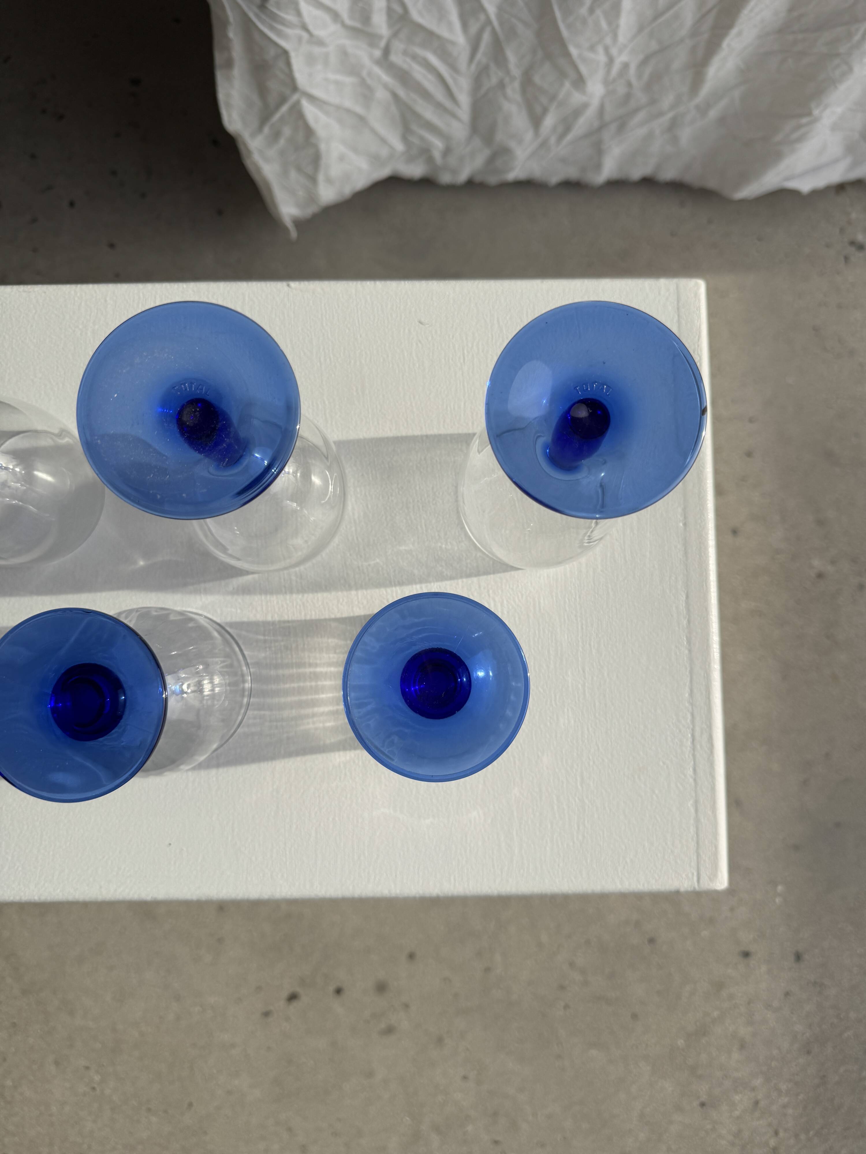 Set of 3 large blue stemmed glasses and 3 small blue stemmed glasses
