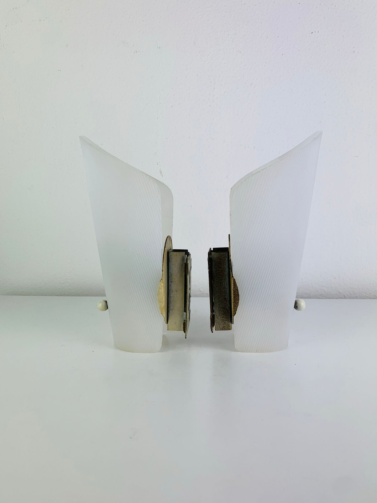 Pair of 1950s striped plastic wall lights.