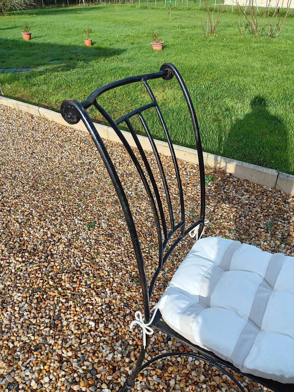 Wrought iron chairs with cushions