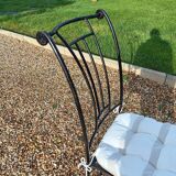 Wrought iron chairs with cushions