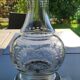 Refined carafe ball shape, pear neck. in finely engraved crystal