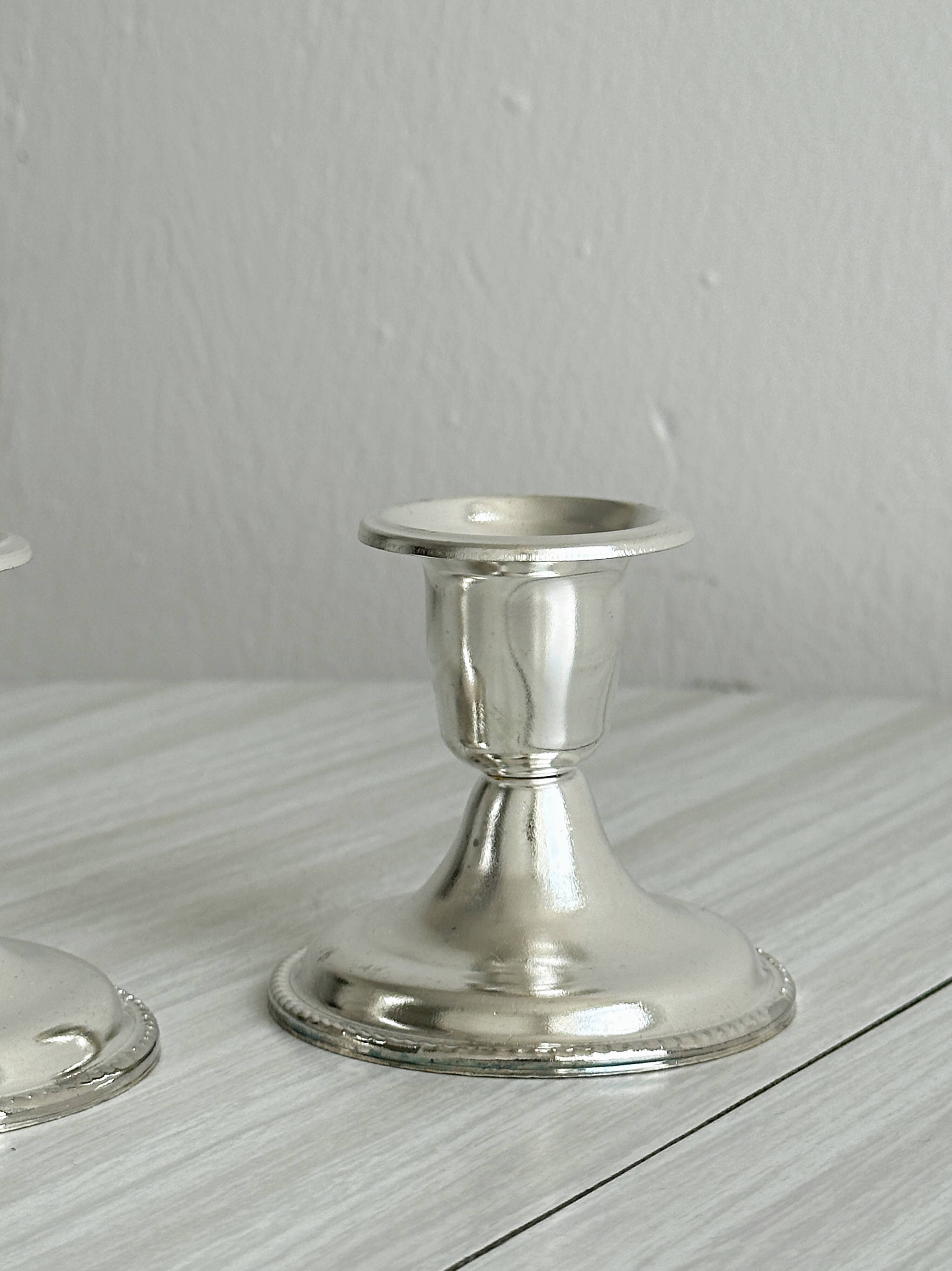 Pair of lightweight silver metal candlesticks