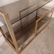 Brass shelf, smoked glass