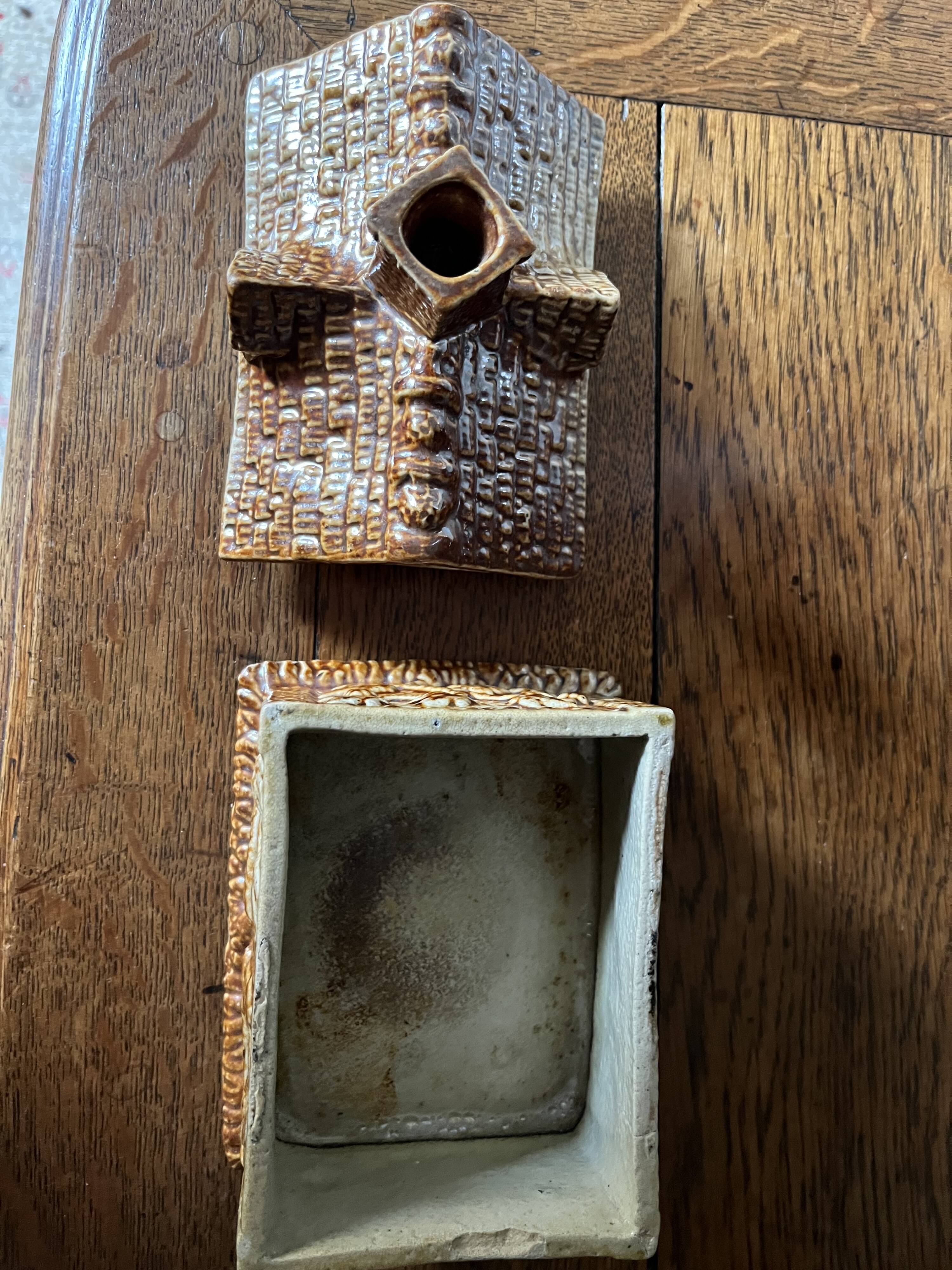 Brown salt-glazed stoneware tobacco pot with candle holder, 1840/1880