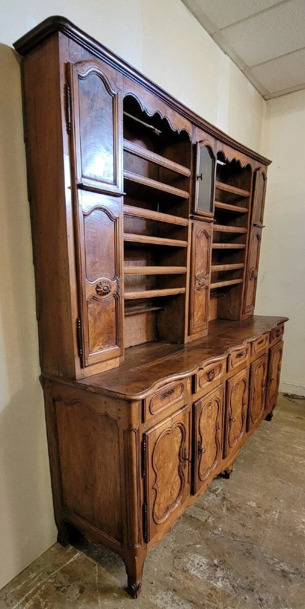 Clockside cabinet from the Louis XV period in walnut and elm, fully carved.