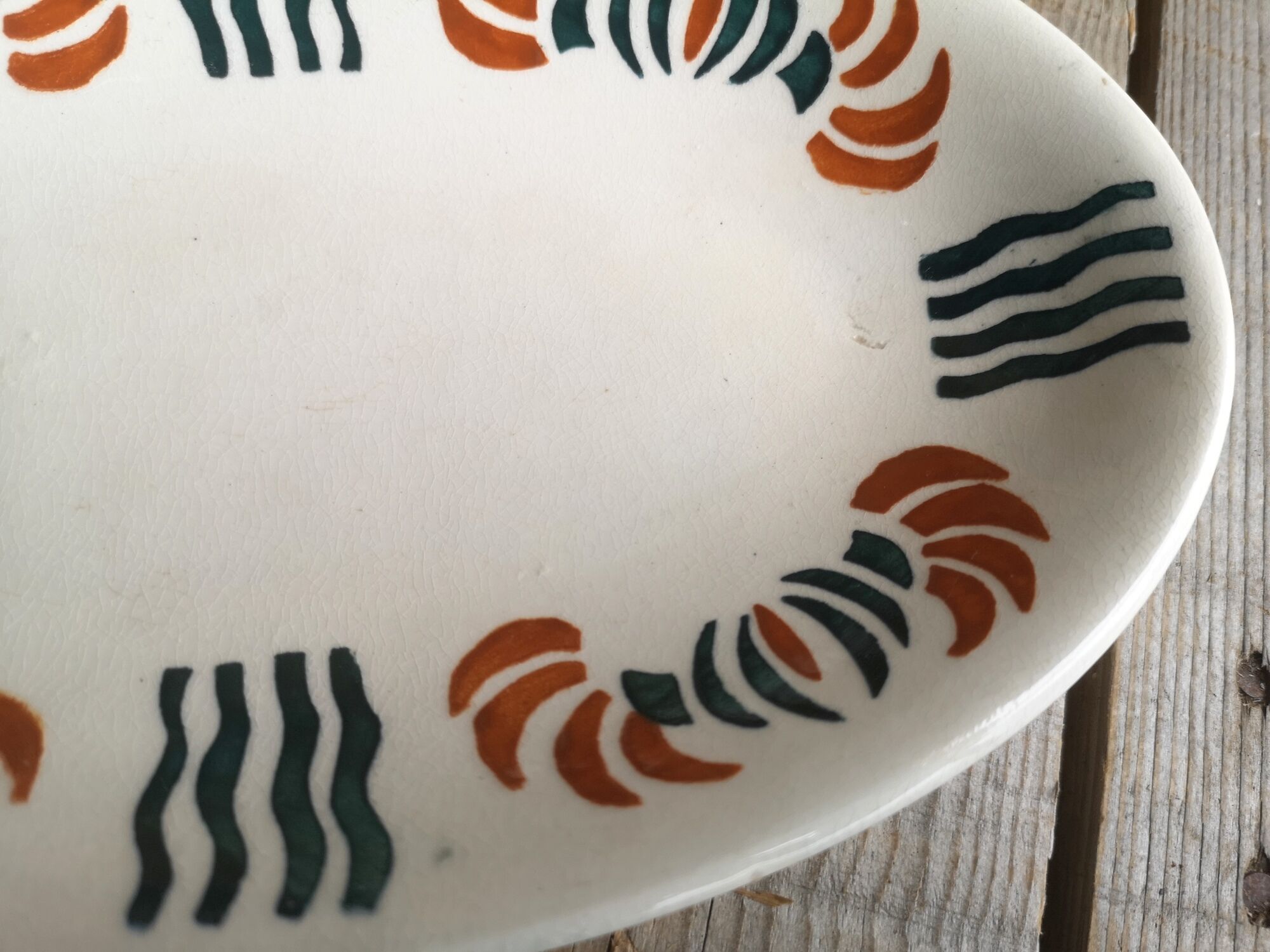 Dish out of ceramics decor orange and green