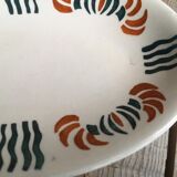 Dish out of ceramics decor orange and green