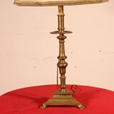 bronze candlestick from the 17th century converted into a lamp with its lampshade
