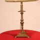bronze candlestick from the 17th century converted into a lamp with its lampshade