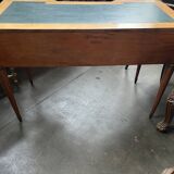 Louis XVI style marquetry desk. The top is decorated with green leather.