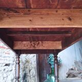 Old French farmhouse table in walnut with turned legs.