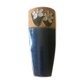 Vase in reeds with stylized flowers