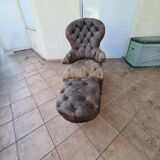 Chesterfield armchair with folding footrest