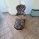 Chesterfield armchair with folding footrest