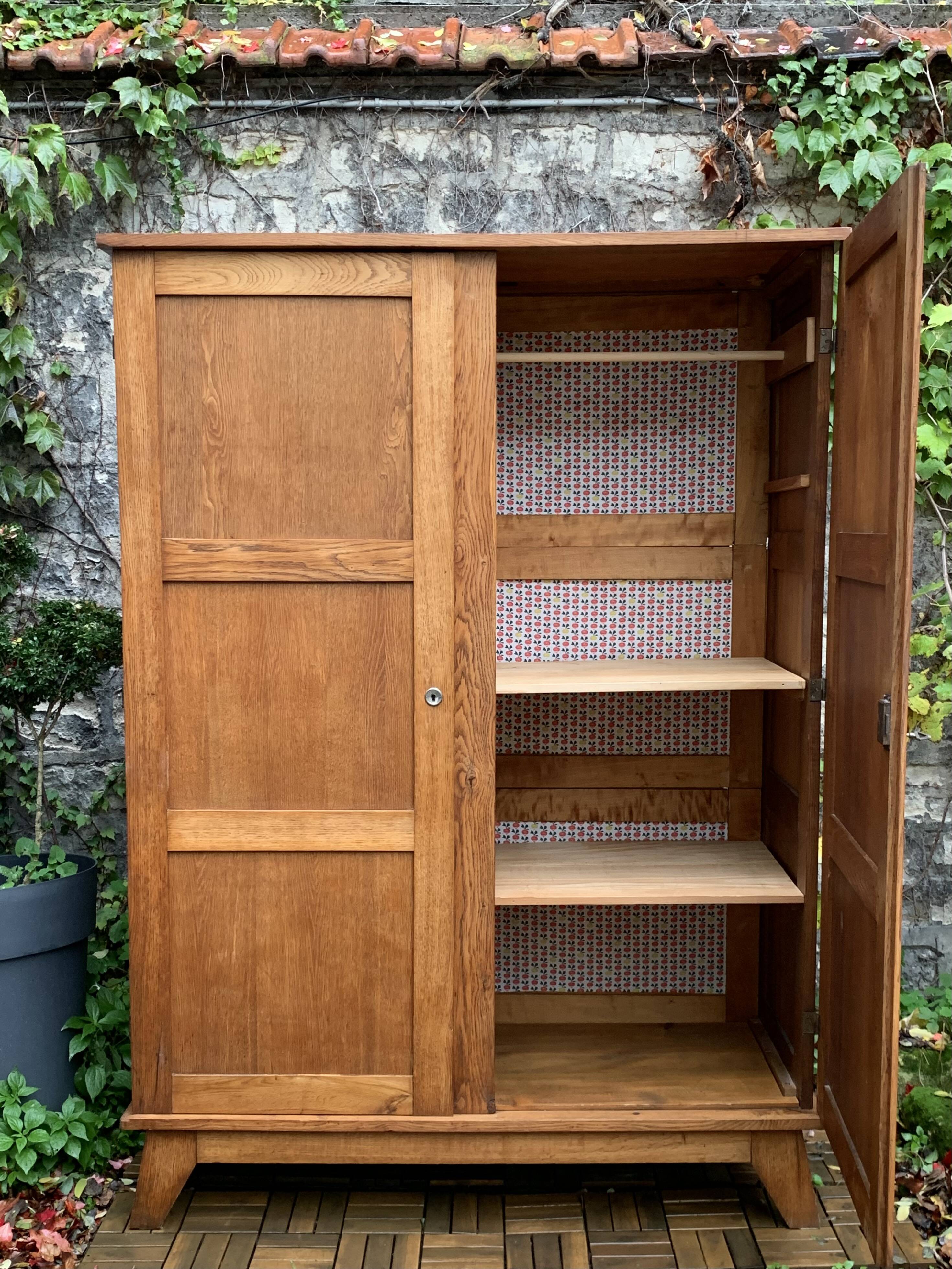 Solid oak compass foot cabinet René Gabriel 1945