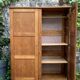 Solid oak compass foot cabinet René Gabriel 1945