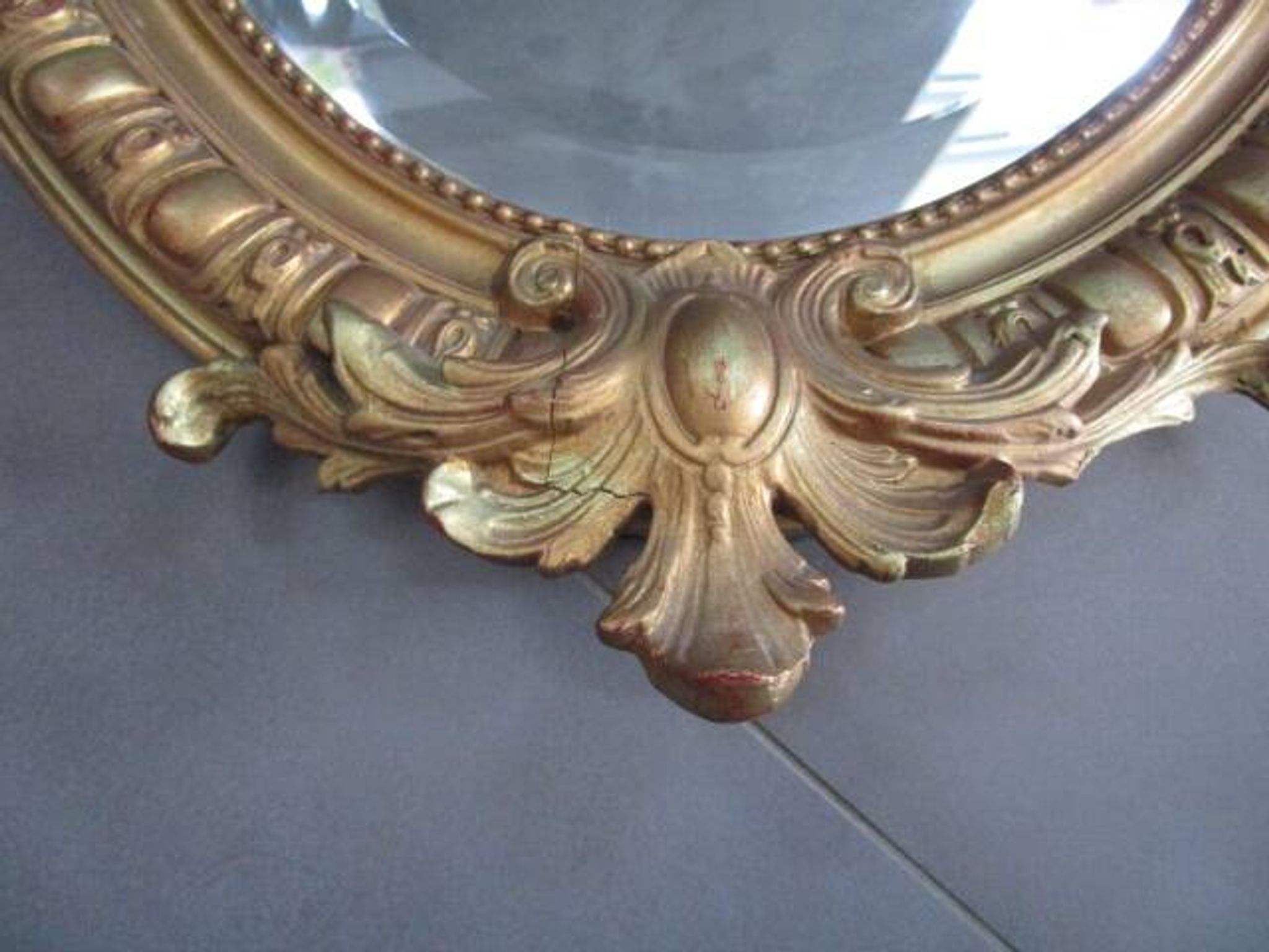 Antique mirror in wood and gilded stucco