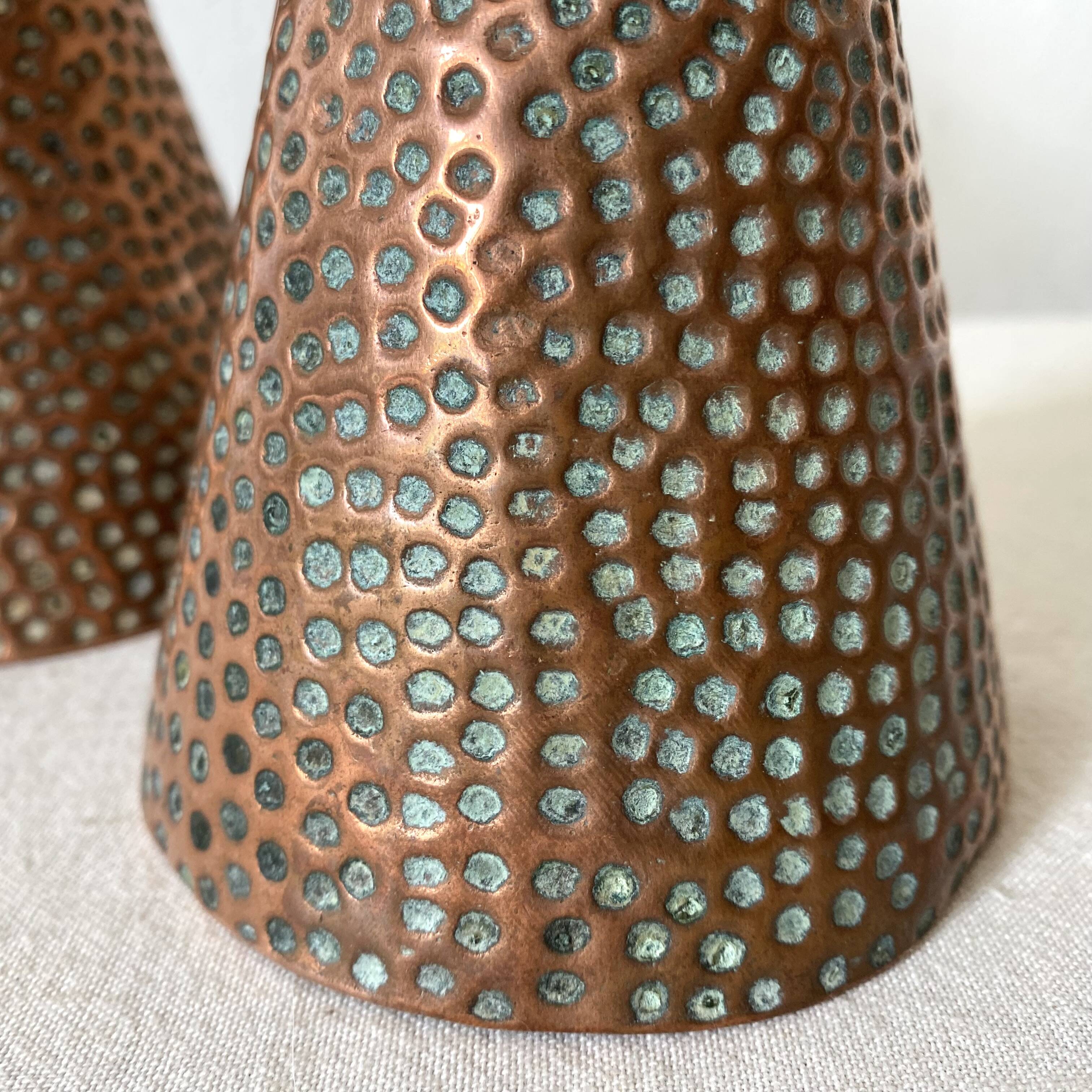 Pair of hammered copper candlesticks from the 1950s