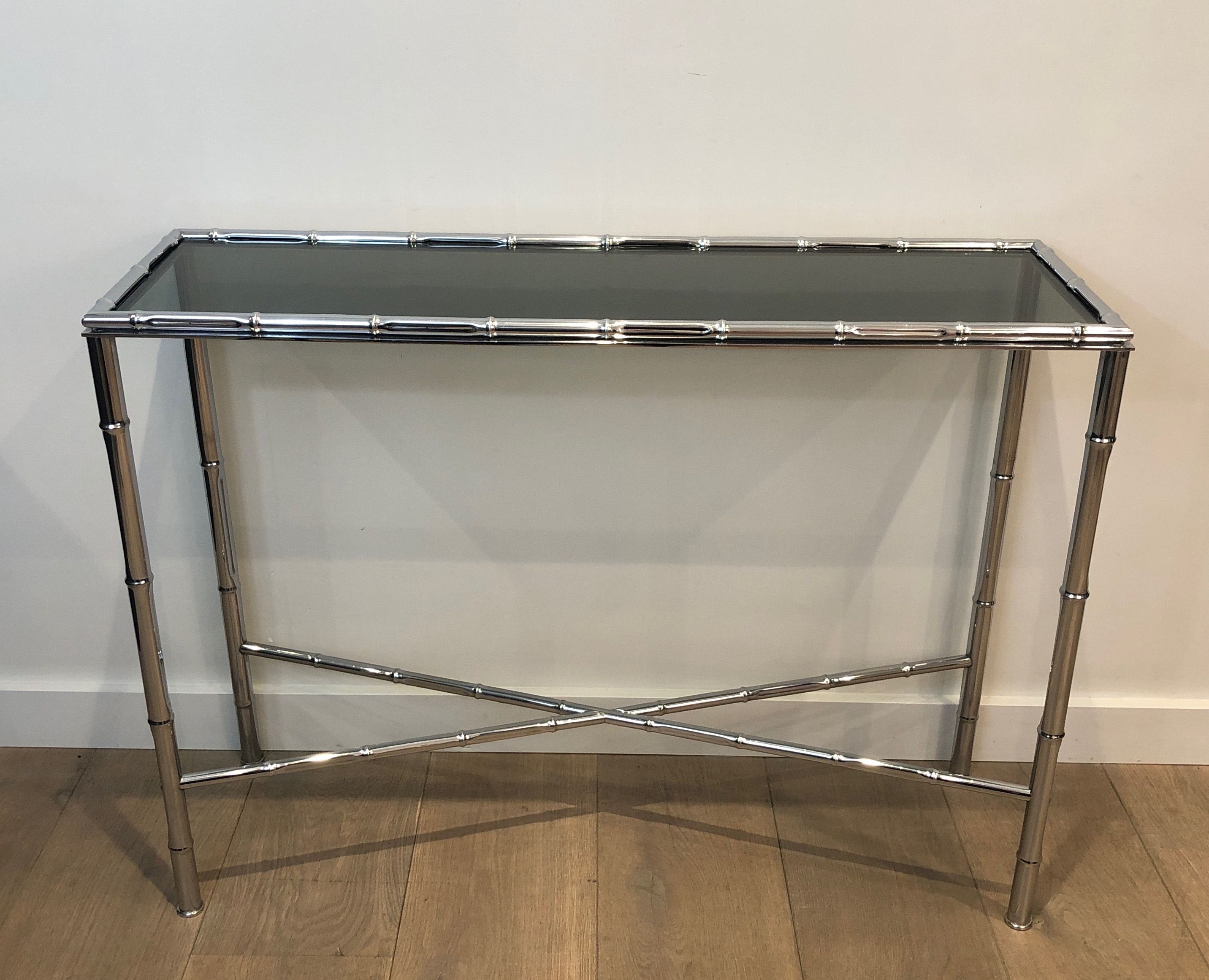 Console and chrome faux-bamboo mirror