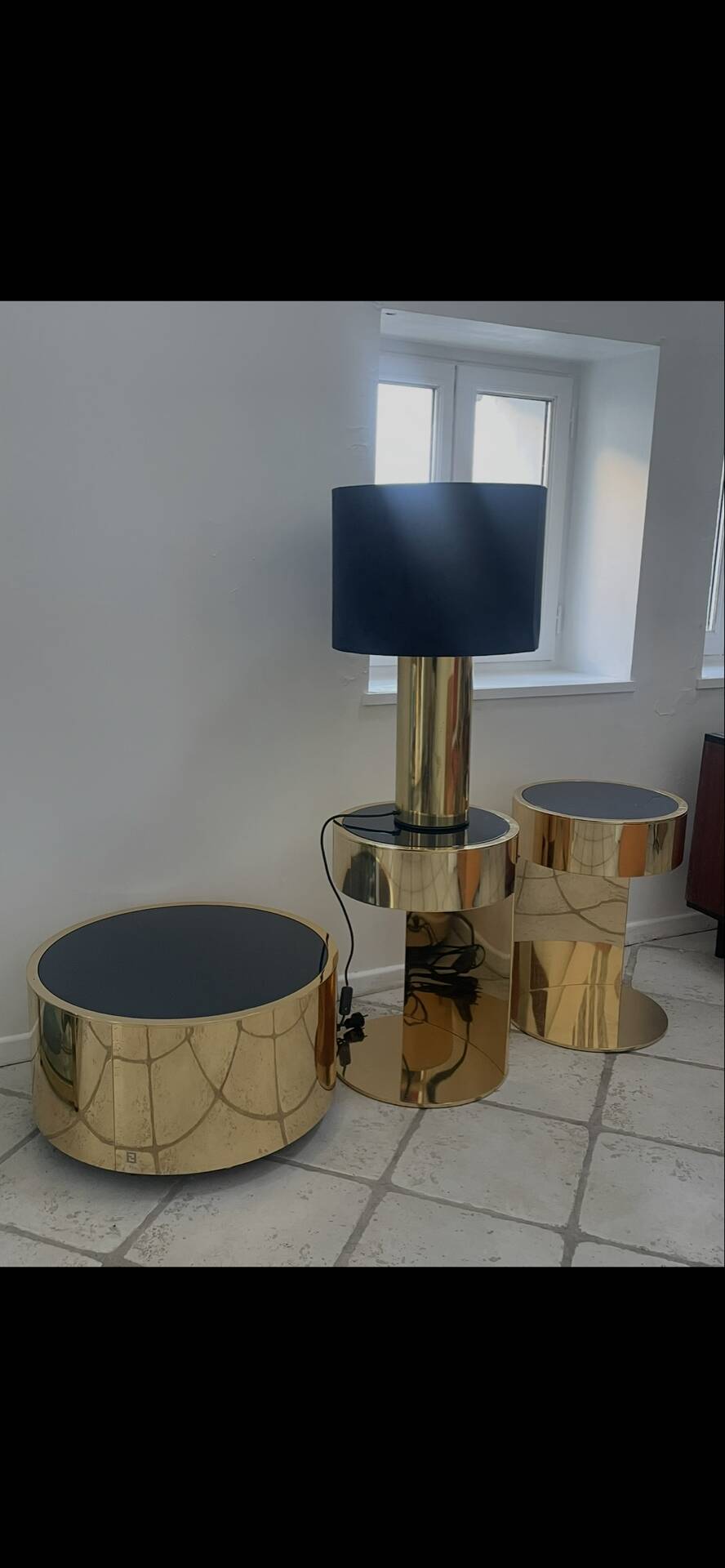 2 bedside tables and a brass Fendi table.
