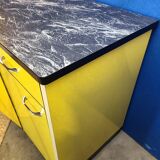 Vintage yellow sideboard, and black marble top.