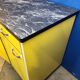 Vintage yellow sideboard, and black marble top.