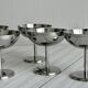 6 small stainless steel dessert bowls on stands