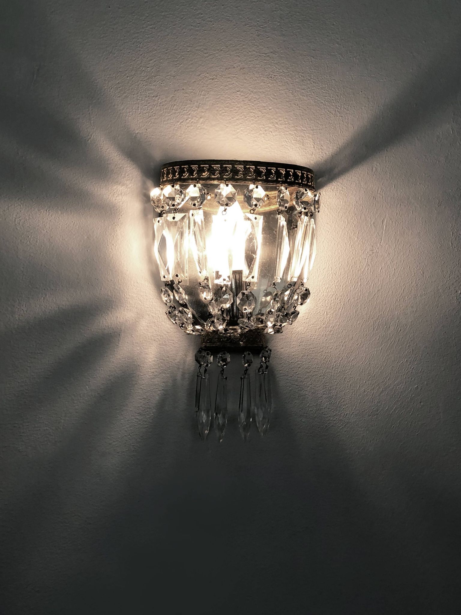 Pair of vintage bronze basket wall lights with glass pendants. The 50's