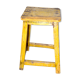 Tabouret jaune en teck