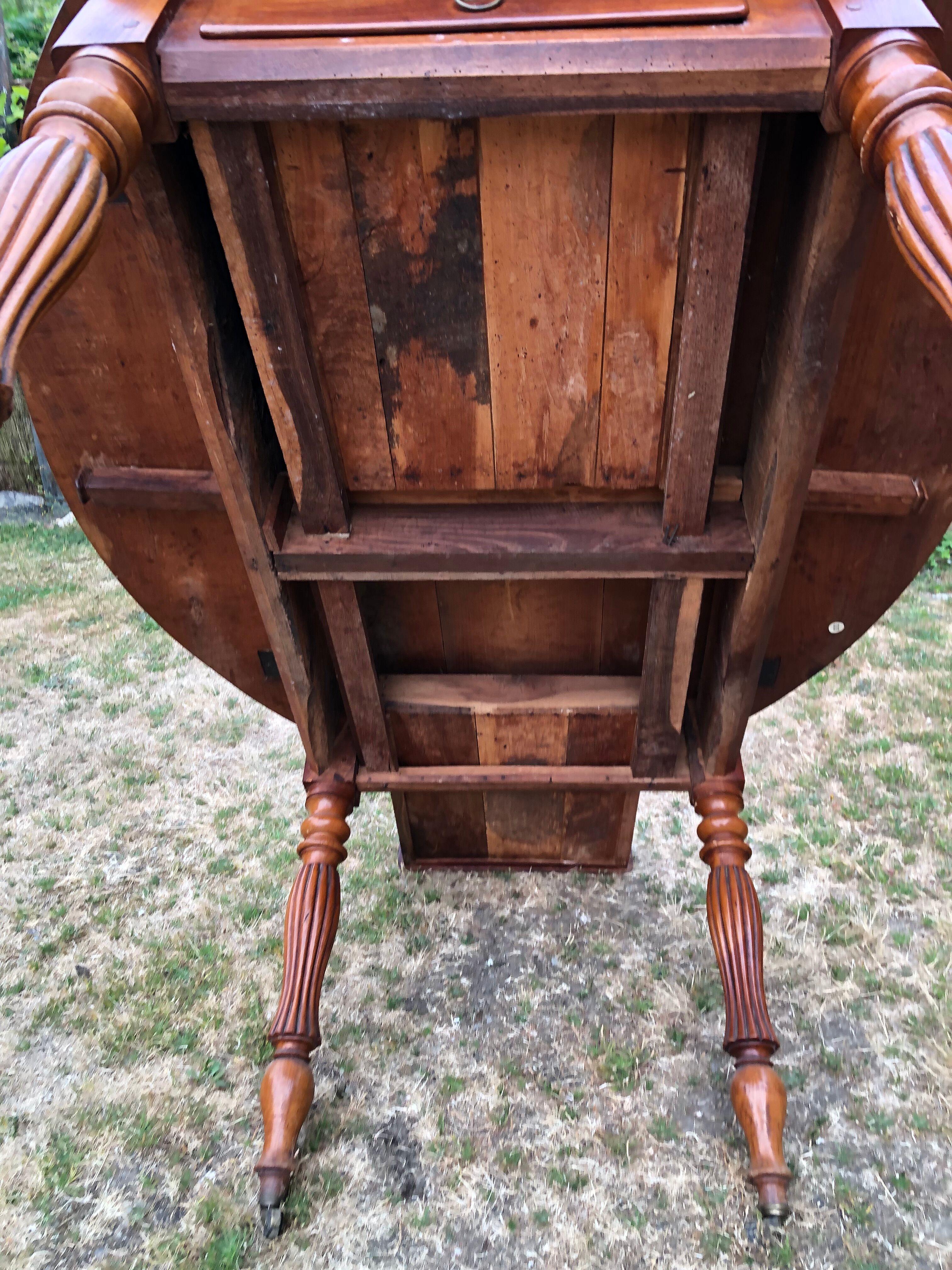 Louis Philippe oval drop-leaf table in solid cherry wood with 2 drawers.