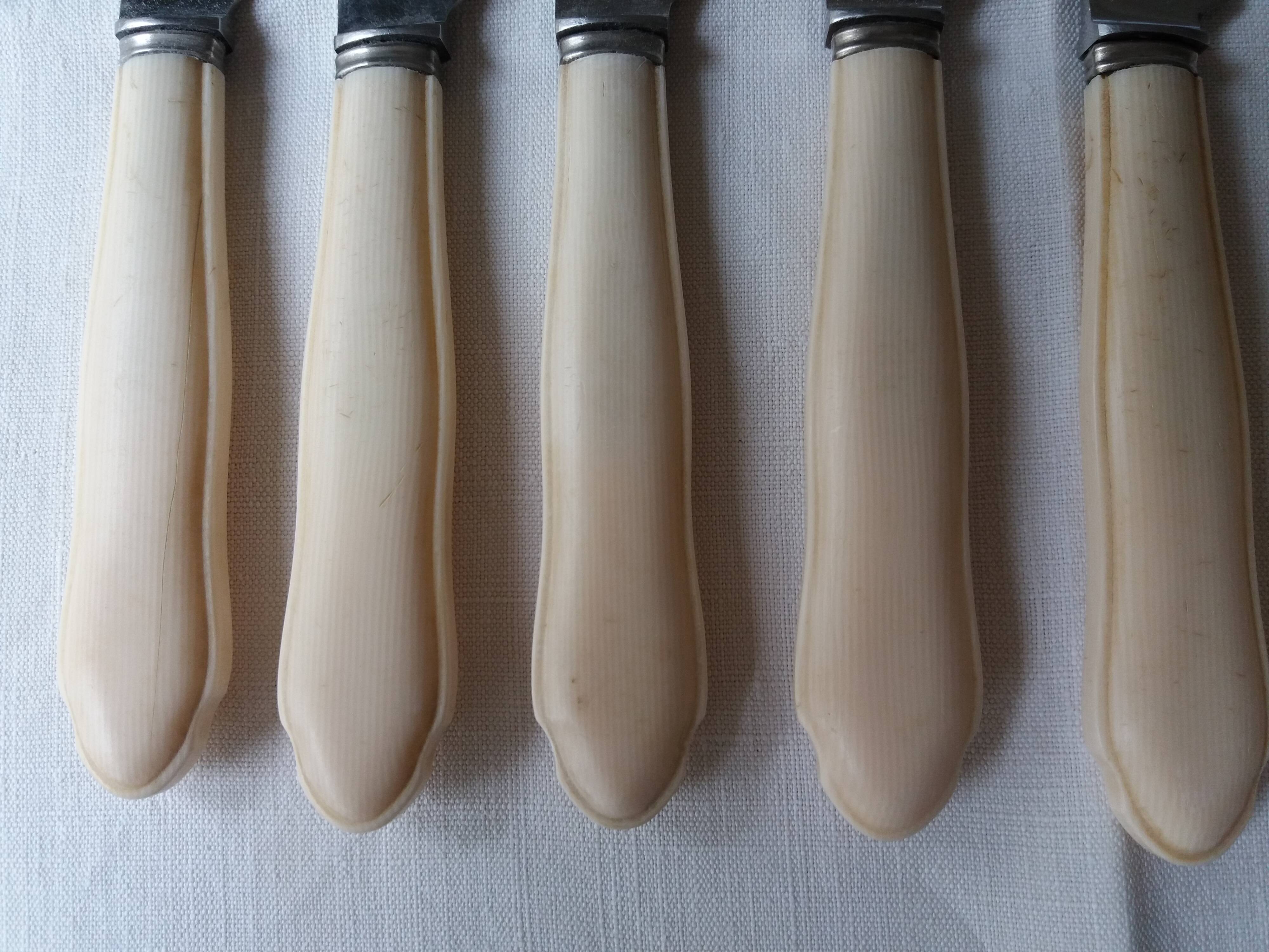 Set of twelve art deco knives with ivory handle
