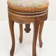 Swivel piano stool with screw, Louis XV style, in walnut.
