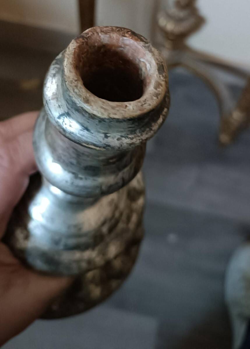 Rare pair of antique silvered terracotta candlesticks from the 17th century.