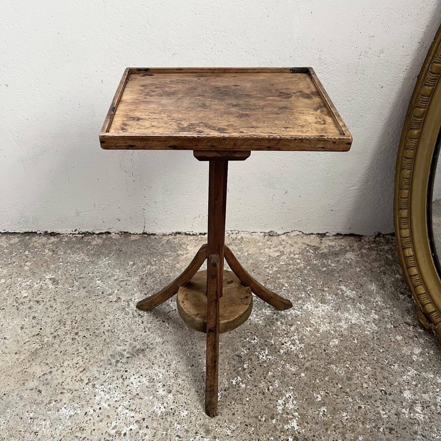 Old primitive wooden tripod pedestal table