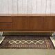1970s English enfilade in teak with splayed legs.