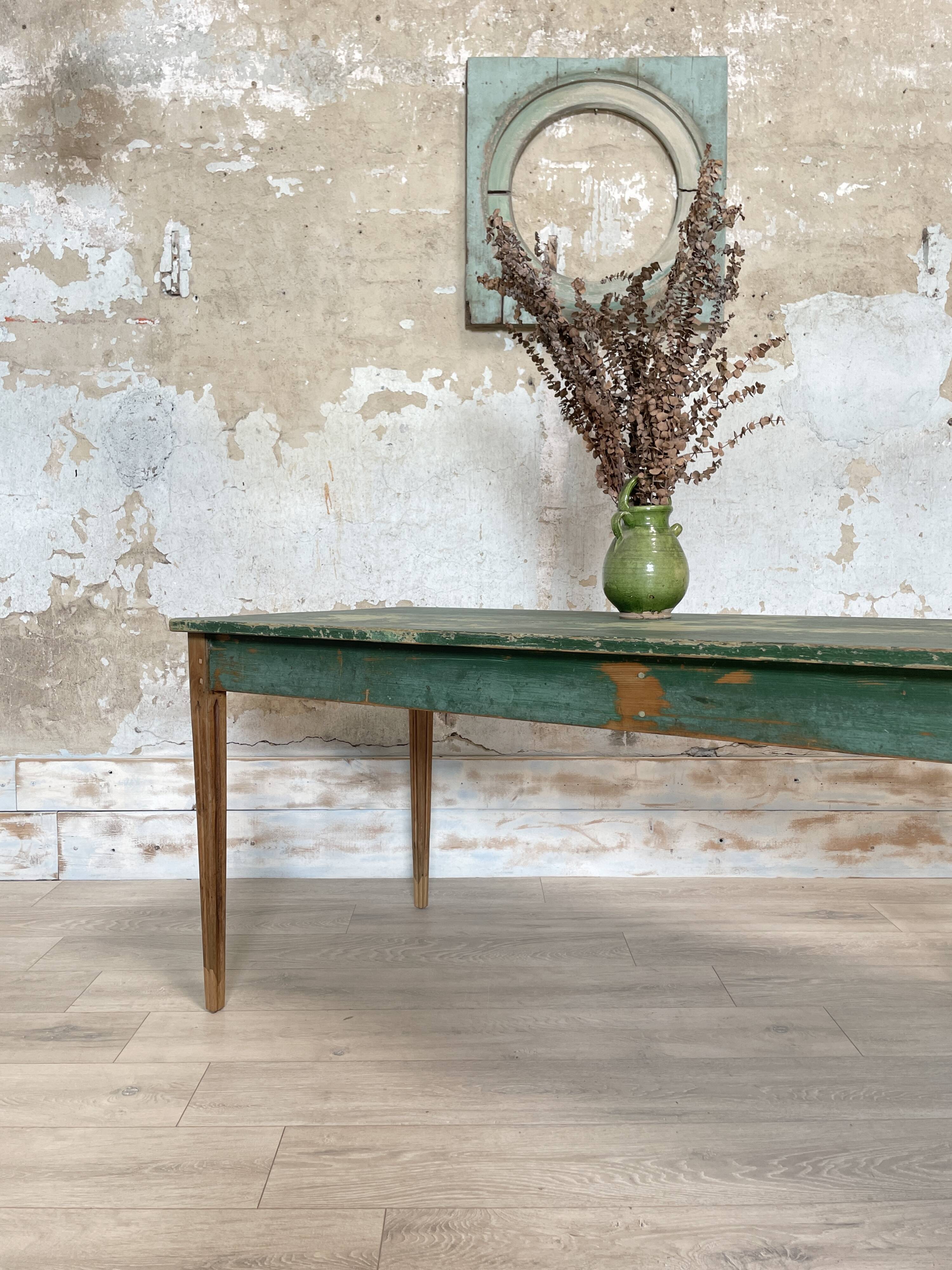 Vintage farm table with spindle legs.